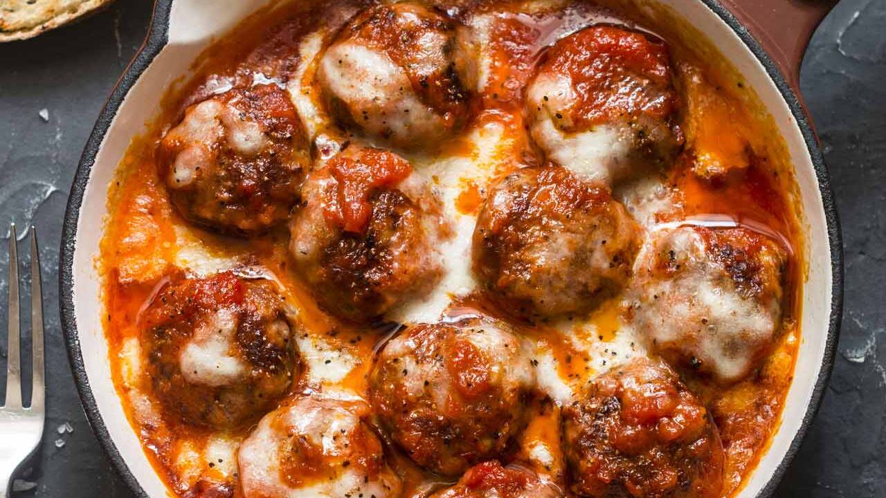 Beef meatballs in tomato sauce with melted mozzarella